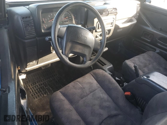 2003 Jeep Wrangler X z VIN 1J4FA39S33P320254, wystawiony jako Copart lot #52392525 z przebiegiem 206 325 mil mil oraz Szkoda całkowita • Salvage title. Historia ofert i sprzedaży dostępna na DreamBid. Obrazek 8.