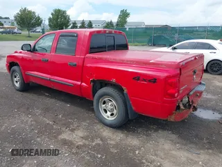 2007 Dodge Dakota SLT with VIN 1D7HW48N17S128373, listed as a IAAI auction lot 42633897 with 129,780 mi miles and . Bid and sale history available at DreamBid. Image 3.