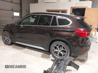 2016 BMW X1 xDrive28i with VIN WBXHT3C33GP886935, listed as a IAAI auction lot 41707367 with 73,201 mi miles. Bid and sale history available at carsss.com. Image 3.