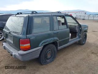 1994 Jeep Grand Cherokee Laredo with VIN 1J4GZ58S9RC215874, listed as a IAAI auction lot 42577378 with 230,824 mi miles and . Bid and sale history available at DreamBid. Image 4.