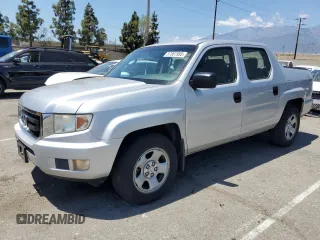 2009 Honda Ridgeline RT z VIN 2HJYK16279H501368, wystawiony jako Copart lot #57087995 z przebiegiem 199 877 mil mil oraz Szkoda całkowita • Salvage title. Historia ofert i sprzedaży dostępna na DreamBid. Obrazek 1.