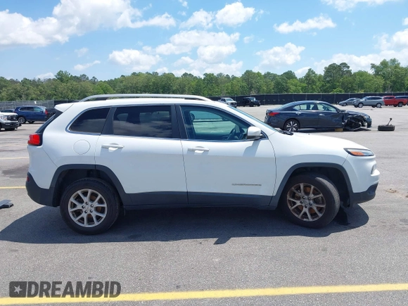 2016 Jeep Cherokee Latitude with VIN 1C4PJLCB0GW291357, listed as a IAAI auction lot 42312356 with 105,692 mi miles and . Bid and sale history available at DreamBid. Image 14.