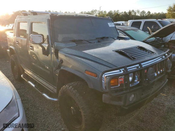 2005 Hummer H2 SUT with VIN 5GRGN22U15H125141, listed as a Copart auction lot 74180754 with 0 mi miles and Salvage Title. Bid and sale history available at carsss.com. Image 4.