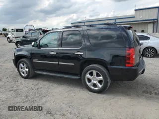 2014 Chevrolet Tahoe LTZ with VIN 1GNSKCE0XER228028, listed as a Copart auction lot 56971135 with 155,285 mi miles and Salvage title. Bid and sale history available at DreamBid. Image 2.