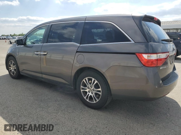 2011 Honda Odyssey EX-L with VIN 5FNRL5H61BB056652, listed as a Copart auction lot 54774015 with 233,125 mi miles and Salvage Title. Bid and sale history available at DreamBid. Image 2.