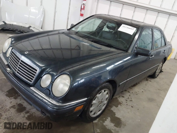 1997 Mercedes-Benz E-Class with VIN WDBJF55F8VA415421, listed as a IAAI auction lot 41536015 with 237,345 mi miles. Bid and sale history available at carsss.com. Image 2.