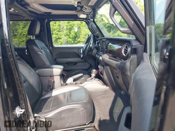 2020 Jeep Wrangler Unlimited Sahara High Altitude with VIN 1C4HJXEGXLW182581, listed as a IAAI auction lot 42612084 with 52,656 mi miles and . Bid and sale history available at DreamBid. Image 5.
