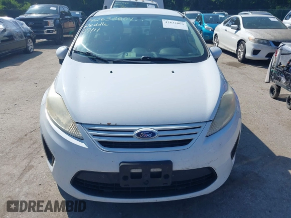 2013 Ford Fiesta S with VIN 3FADP4AJ7DM184180, listed as a IAAI auction lot 42632804 with 176,729 mi miles and . Bid and sale history available at DreamBid. Image 6.
