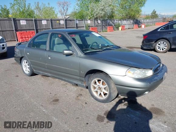 1999 Ford Contour SE Fleet z VIN 1FAFP66L7XK115659, wystawiony jako IAAI lot #42142065 z przebiegiem 161 018 mil mil oraz . Historia ofert i sprzedaży dostępna na DreamBid. Obrazek 1.