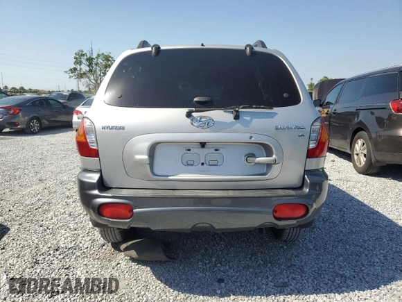 2003 Hyundai Santa Fe GLS z VIN KM8SC13D23U370587, wystawiony jako Copart lot #52775885 z przebiegiem Nie podano mil oraz Szkoda całkowita • Salvage title. Historia ofert i sprzedaży dostępna na DreamBid. Obrazek 6.