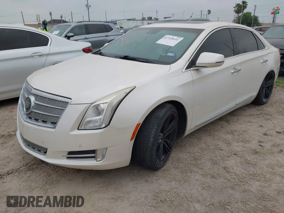 2013 Cadillac XTS Platinum z VIN 2G61U5S3XD9208737, wystawiony jako IAAI lot #41928451 z przebiegiem 167 984 mil mil oraz . Historia ofert i sprzedaży dostępna na DreamBid. Obrazek 2.