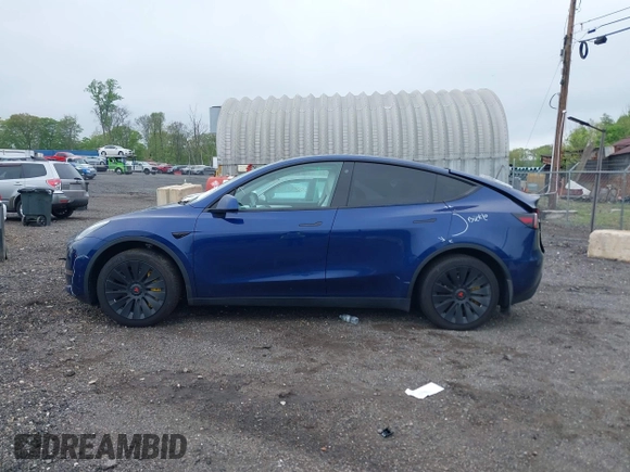 2023 Tesla Model Y Long Range z VIN 7SAYGDEE6PF603981, wystawiony jako IAAI lot #42133348 z przebiegiem 28 566 mil mil oraz . Historia ofert i sprzedaży dostępna na DreamBid. Obrazek 15.