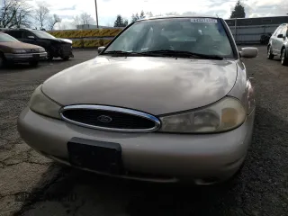 1998 Ford Contour SE z VIN 1FAFP6637WK280190, wystawiony jako Copart lot #84331424 z przebiegiem 185 754 mil mil oraz Czysty tytuł • Clean title. Historia ofert i sprzedaży dostępna na DreamBid. Obrazek 5.