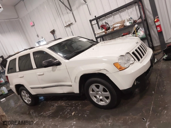 2010 Jeep Grand Cherokee Laredo with VIN 1J4PR4GK1AC143486, listed as a IAAI auction lot 41761763 with 159,139 mi miles. Bid and sale history available at carsss.com. Image 13.