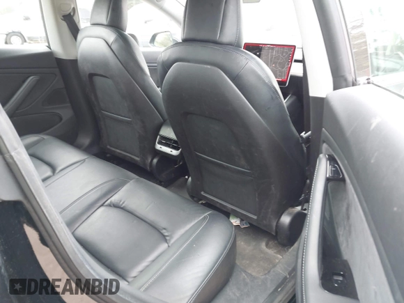 2019 Tesla Model 3 Mid Range with VIN 5YJ3E1EA6KF415656, listed as a IAAI auction lot 42140763 with 71,408 mi miles and . Bid and sale history available at carsss.com. Image 8.