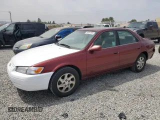 1999 Toyota Camry LE z VIN JT2BF22K8X0181675, wystawiony jako Copart lot #55057875 z przebiegiem 184 657 mil mil oraz Szkoda całkowita • Salvage title. Historia ofert i sprzedaży dostępna na DreamBid. Obrazek 1.