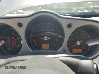 2007 Nissan 350Z Touring z VIN JN1BZ36A67M654488, wystawiony jako Copart lot #57431255 z przebiegiem 77 047 mil mil oraz Czysty tytuł • Clean title. Historia ofert i sprzedaży dostępna na DreamBid. Obrazek 9.