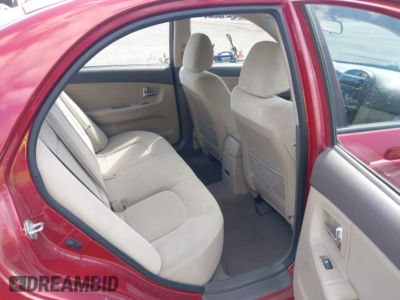 2009 Kia Spectra EX with VIN KNAFE222195661572, listed as a IAAI auction lot 42148750 with 137,773 mi miles. Bid and sale history available at carsss.com. Image 8.
