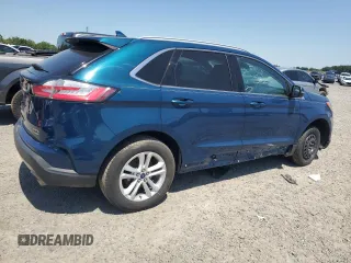 2020 Ford Edge SEL z VIN 2FMPK3J9XLBA59093, wystawiony jako Copart lot #52542645 z przebiegiem 128 059 mil mil oraz Czysty tytuł • Clean title. Historia ofert i sprzedaży dostępna na DreamBid. Obrazek 3.