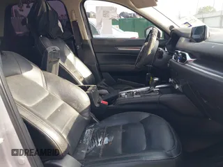 2020 Mazda CX-5 Grand Touring with VIN JM3KFADM5L0739306, listed as a IAAI auction lot 42215667 with 126,100 mi miles and . Bid and sale history available at DreamBid. Image 5.