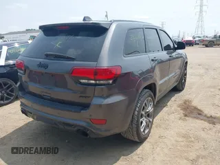 2018 Jeep Grand Cherokee SRT z VIN 1C4RJFDJ7JC281644, wystawiony jako IAAI lot #42481239 z przebiegiem 160 218 mil mil oraz . Historia ofert i sprzedaży dostępna na DreamBid. Obrazek 4.