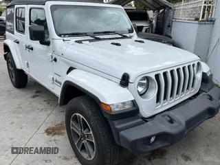 2023 Jeep Wrangler Sahara with VIN 1C4HJXENXPW586579, listed as a IAAI auction lot 41795621 with 34,433 mi miles. Bid and sale history available at carsss.com. Image 1.
