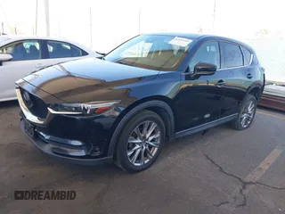 2020 Mazda CX-5 Grand Touring z VIN JM3KFADMXL0740144, wystawiony jako IAAI lot #41830203 z przebiegiem 70 535 mil mil oraz . Historia ofert i sprzedaży dostępna na DreamBid. Obrazek 17.