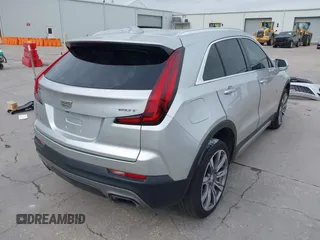 2019 Cadillac XT4 FWD Premium Luxury z VIN 1GYFZCR42KF189610, wystawiony jako IAAI lot #42137690 z przebiegiem 92 502 mil mil oraz . Historia ofert i sprzedaży dostępna na DreamBid. Obrazek 4.