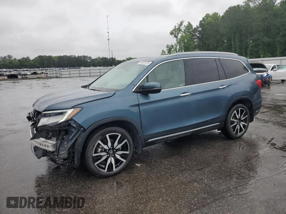 2022 Honda Pilot Touring 7-Passenger z VIN 5FNYF5H63NB015091, wystawiony jako Copart lot #56323725 z przebiegiem 28 614 mil mil oraz Szkoda całkowita • Salvage title. Historia ofert i sprzedaży dostępna na DreamBid. Obrazek 1.