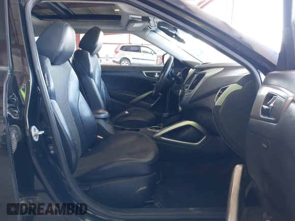 2012 Hyundai Veloster w/Gray Int z VIN KMHTC6AD0CU062046, wystawiony jako IAAI lot #42182993 z przebiegiem 148 574 mil mil oraz . Historia ofert i sprzedaży dostępna na DreamBid. Obrazek 5.