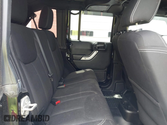 2015 Jeep Wrangler Unlimited Rubicon with VIN 1C4BJWFG4FL566862, listed as a IAAI auction lot 42310901 with 146,206 mi miles and . Bid and sale history available at DreamBid. Image 8.
