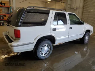 1997 GMC Jimmy SLS z VIN 1GKDT13W8V2548861, wystawiony jako Copart lot #55925445 z przebiegiem 135 549 mil mil oraz Szkody całkowita. Historia ofert i sprzedaży dostępna na DreamBid. Obrazek 3.