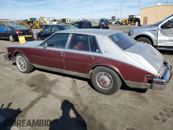 1984 Cadillac Seville z VIN 1G6AS6984EE826325, wystawiony jako Copart lot #77209864 z przebiegiem 26 366 mil mil oraz Czysty tytuł • Clean title. Historia ofert i sprzedaży dostępna na DreamBid. Obrazek 2.
