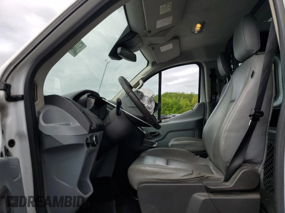 2016 Ford Transit Cargo with VIN 1FTYR1ZM1GKA62977, listed as a Copart auction lot 57054015 with 62,670 mi miles and Salvage title. Bid and sale history available at DreamBid. Image 7.