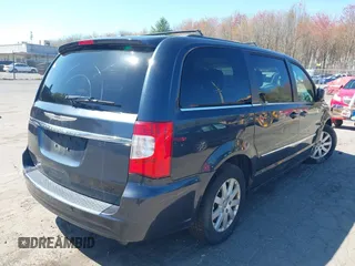 2014 Chrysler Town & Country Touring with VIN 2C4RC1BG1ER453328, listed as a IAAI auction lot 42135021 with 138,443 mi miles. Bid and sale history available at carsss.com. Image 4.