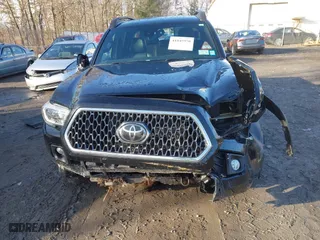 2019 Toyota Tacoma 4WD SR with VIN 3TMCZ5AN0KM261364, listed as a IAAI auction lot 41845950 with 85,230 mi miles. Bid and sale history available at carsss.com. Image 6.