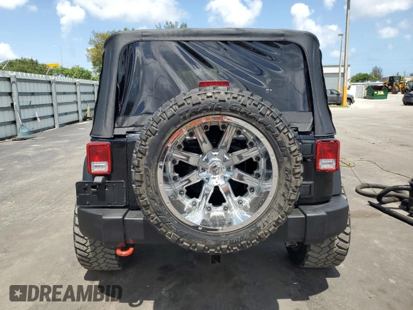 2014 Jeep Wrangler Sport with VIN 1C4AJWAG1EL200181, listed as a Copart auction lot 61165595 with 101,234 mi miles and Salvage title. Bid and sale history available at DreamBid. Image 6.