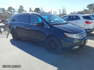 2013 Honda Odyssey Touring with VIN 5FNRL5H99DB076385, listed as a IAAI auction lot 41751504 with 233,875 mi miles. Bid and sale history available at carsss.com. Image 1.