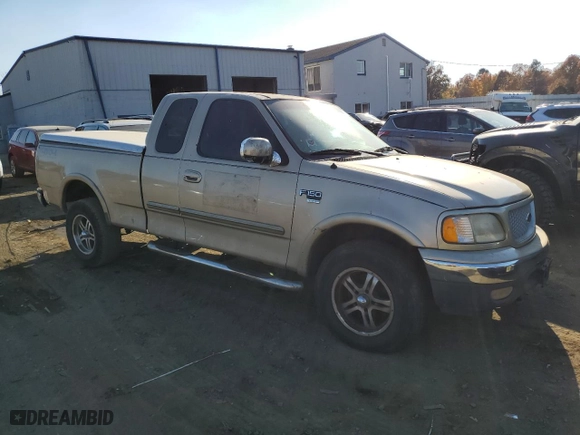 1999 Ford F-150 Work Series with VIN 1FTRX18WXXNA56977, listed as a Copart auction lot 77179044 with 0 mi miles and Salvage Title. Bid and sale history available at carsss.com. Image 4.
