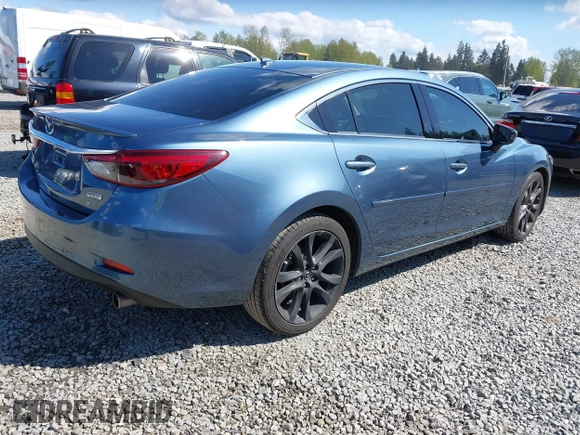 2016 Mazda Mazda6 i Grand Touring with VIN JM1GJ1W51G1436977, listed as a IAAI auction lot 42097363 with 128,941 mi miles. Bid and sale history available at carsss.com. Image 4.