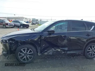2018 Mazda CX-5 Touring with VIN JM3KFBCMXJ0438177, listed as a IAAI auction lot 42152275 with 65,434 mi miles and . Bid and sale history available at carsss.com. Image 6.