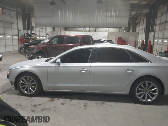 2011 Audi A8 with VIN WAURVAFD5BN014214, listed as a IAAI auction lot 41396044 with 131,764 mi miles and . Bid and sale history available at DreamBid. Image 15.