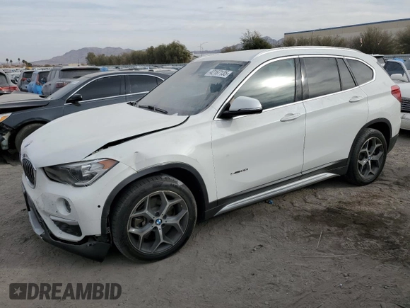 2018 BMW X1 sDrive28i with VIN WBXHU7C37J5H44386, listed as a Copart auction lot 42167135 with 96,668 mi miles and Salvage Title. Bid and sale history available at DreamBid. Image 1.