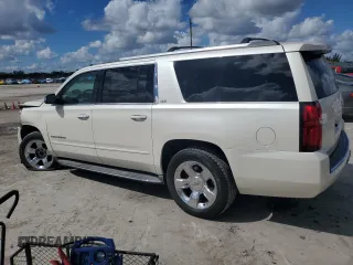 2015 Chevrolet Suburban LTZ with VIN 1GNSKKKC0FR130023, listed as a Copart auction lot 46630825 with 140,057 mi miles and Salvage Title. Bid and sale history available at carsss.com. Image 2.