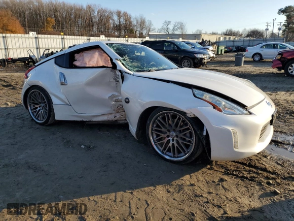 2014 Nissan 370Z Touring with VIN JN1AZ4EH8EM631324, listed as a Copart auction lot 85573524 with 0 mi miles and Salvage Title. Bid and sale history available at carsss.com. Image 4.