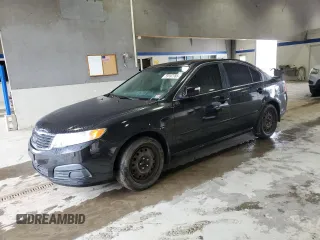 2009 Kia Optima LX z VIN KNAGE228595302847, wystawiony jako Copart lot #59187765 z przebiegiem 235 667 mil mil oraz Czysty tytuł • Clean title. Historia ofert i sprzedaży dostępna na DreamBid. Obrazek 1.