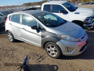 2011 Ford Fiesta SES with VIN 3FADP4FJ4BM113038, listed as a IAAI auction lot 40711045 with 999,999 mi miles. Bid and sale history available at carsss.com. Image 1.