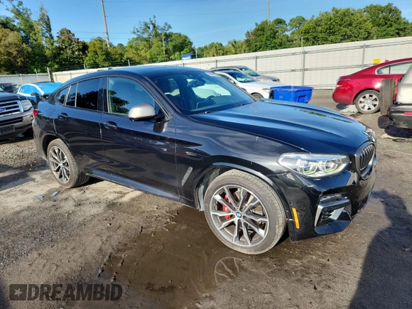 2021 BMW X4 M40i with VIN 5UX2V5C05M9F68427, listed as a Copart auction lot 64941095 with 50,208 mi miles and Salvage title. Bid and sale history available at DreamBid. Image 4.