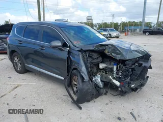 2019 Hyundai Santa Fe SE with VIN 5NMS23AD9KH037136, listed as a IAAI auction lot 41744001 with 150,745 mi miles. Bid and sale history available at carsss.com. Image 1.