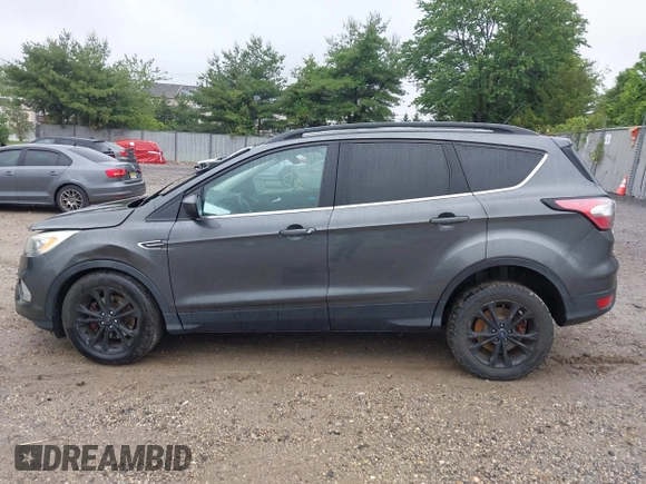 2017 Ford Escape SE z VIN 1FMCU9G95HUC83618, wystawiony jako IAAI lot #42324672 z przebiegiem 132 910 mil mil oraz . Historia ofert i sprzedaży dostępna na DreamBid. Obrazek 14.